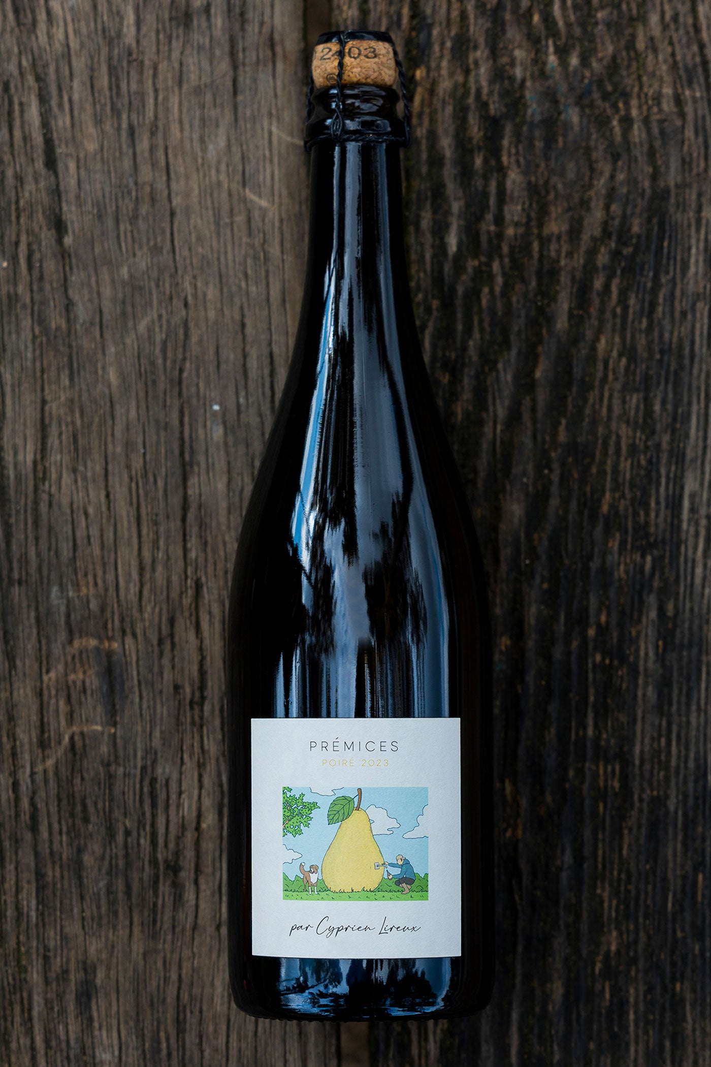 Prémices — bottle of perry on weathered wood